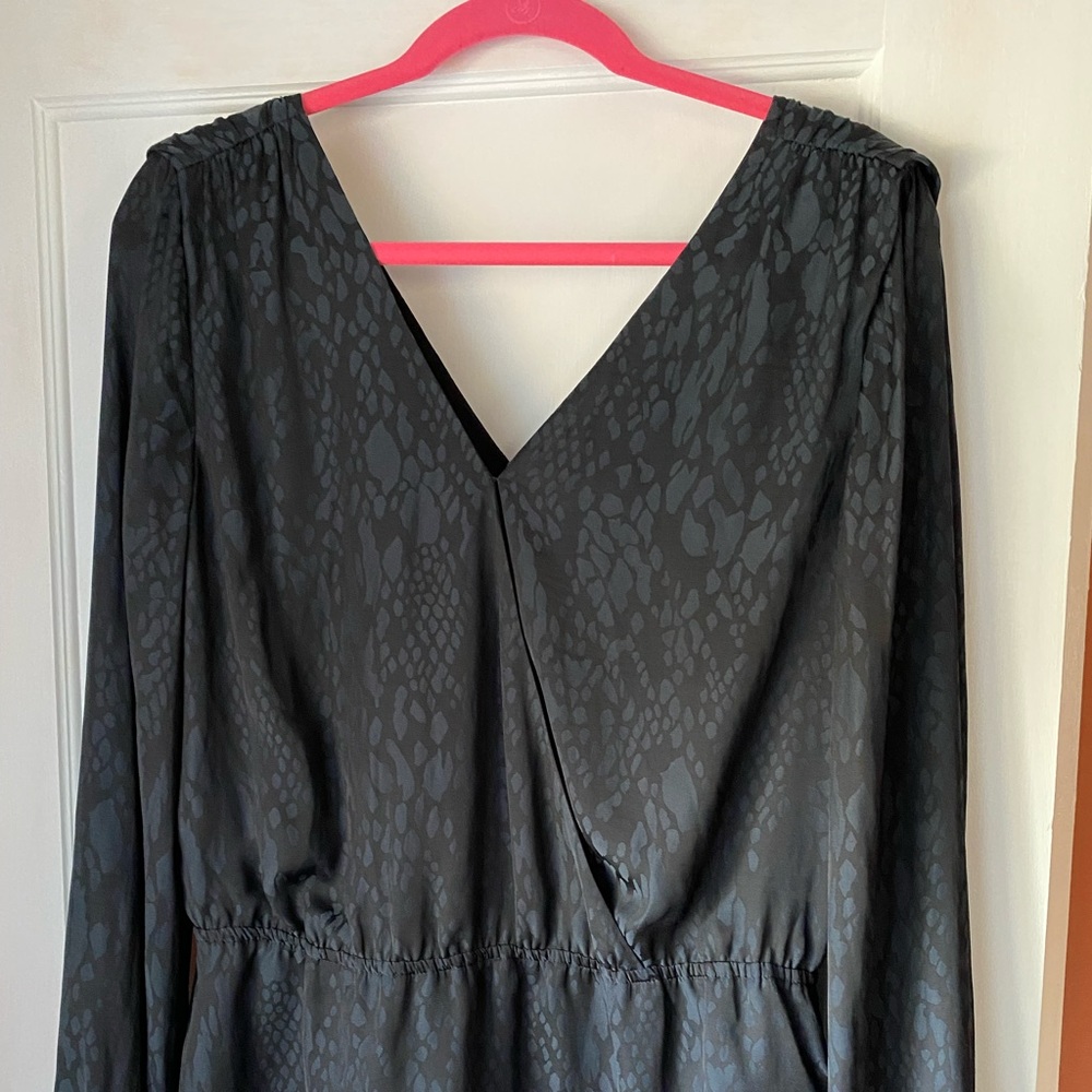 Banana Republic peplum top with vneck surprise front and vneck back.  Black